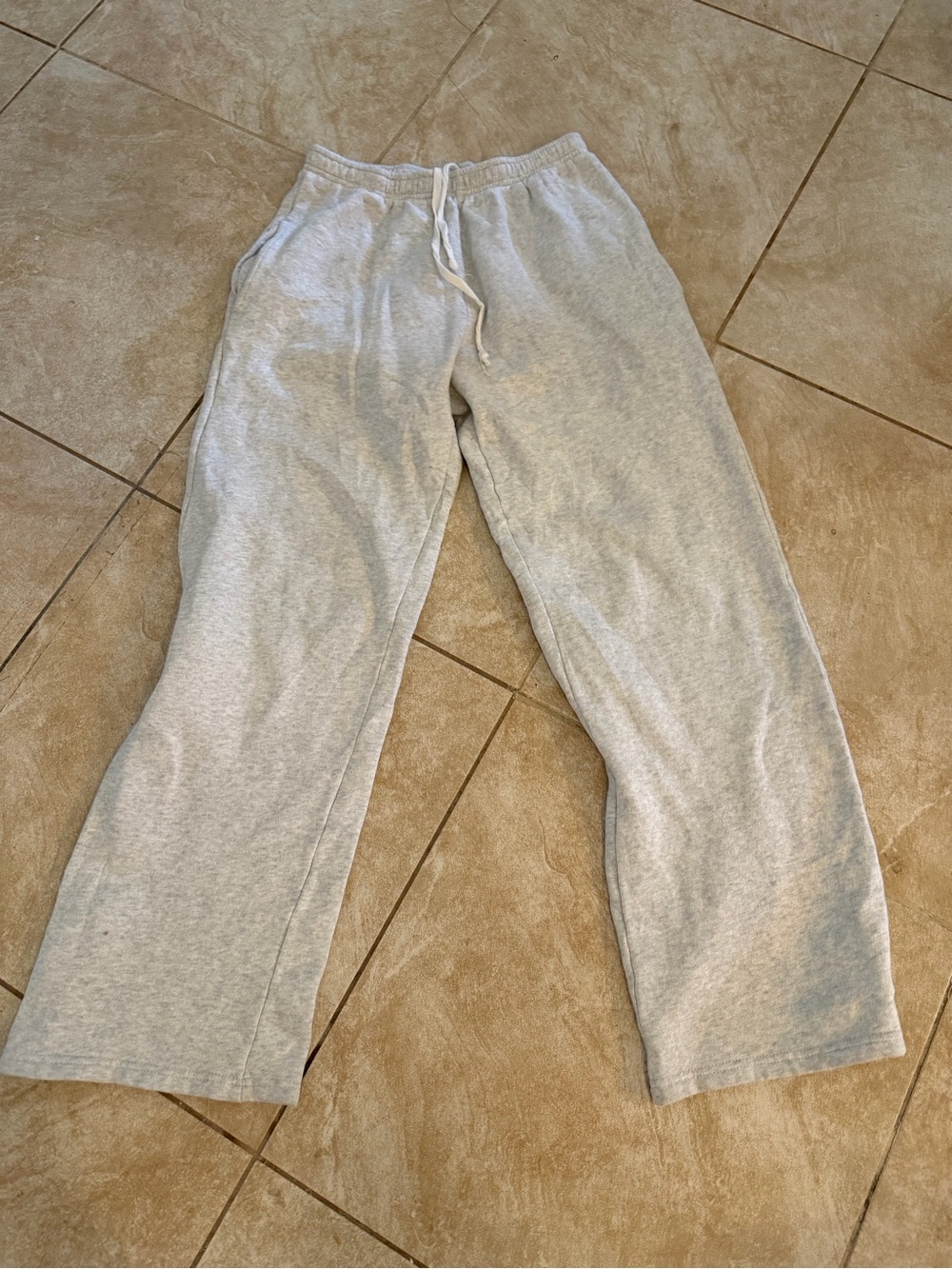 Brandy Melville Light Gray Fleece Lined Sweatpants has a hole